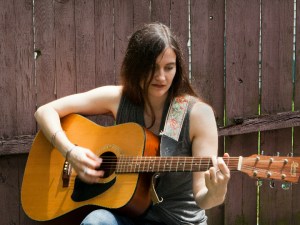 Kirsten Manville playing guitar